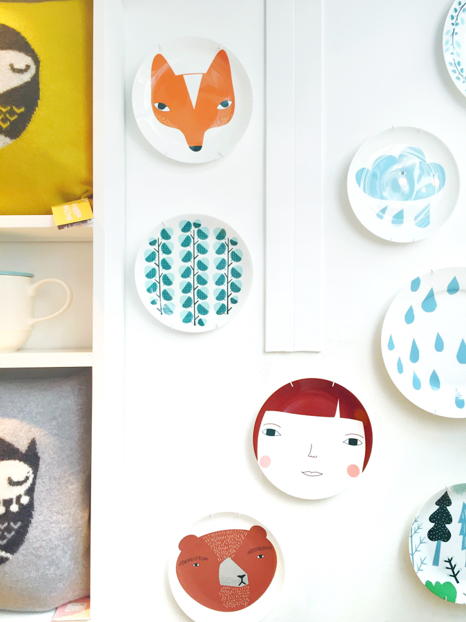 Hanging plates on a wall for instant wall art in Smug, a boutique in London